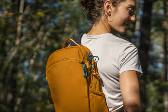 Anti-theft backpack for one shoulder Pacsafe ECO 12L - orange made of econyl.