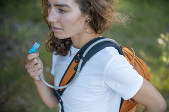 Anti-theft backpack for one shoulder Pacsafe ECO 12L - orange made of econyl.