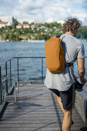 Anti-theft backpack for one shoulder Pacsafe ECO 12L - orange made of econyl.