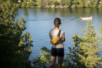 Pacsafe ECO anti-theft hip pack - orange made from econyl.