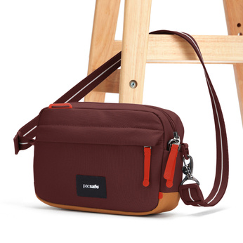 Small urban anti-theft bag Pacsafe Go - burgundy.