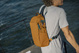 Anti-theft backpack for one shoulder Pacsafe ECO 12L - orange made of econyl.