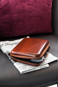 rigid travel organizer TROIKA for cables and chargers - brown.