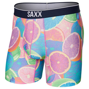 Herren-Sportboxershorts SAXX VOLT Boxer Brief mit leuchtenden Zitrusfrüchten.