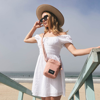 City anti-theft shoulder bag Pacsafe Go - pink