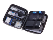 rigid travel organizer TROIKA for cables and chargers.